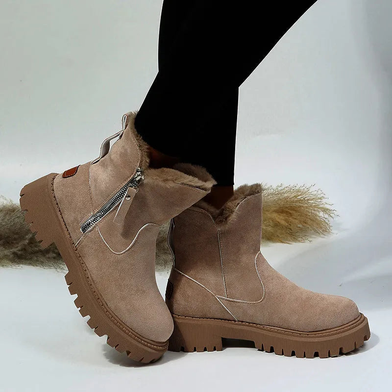Women's black thick plush snow boots with side zipper and faux suede upper on a non-slip rubber sole.