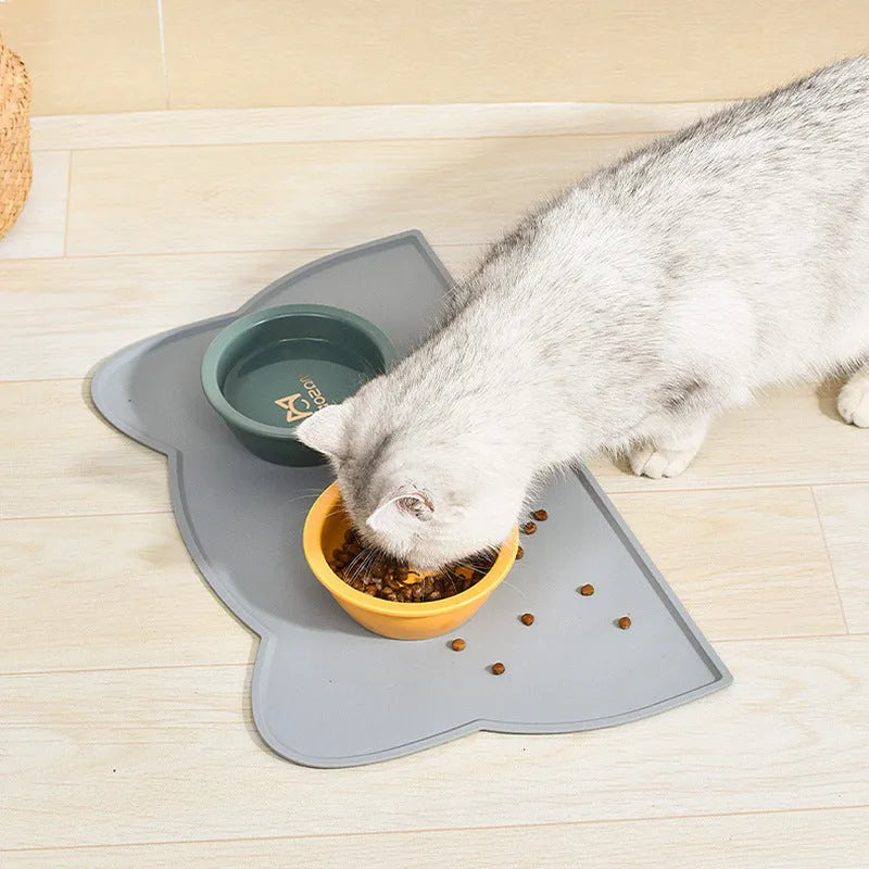 Cat head shaped silicone pet feeding mat in solid colour measuring 44cm by 24cm