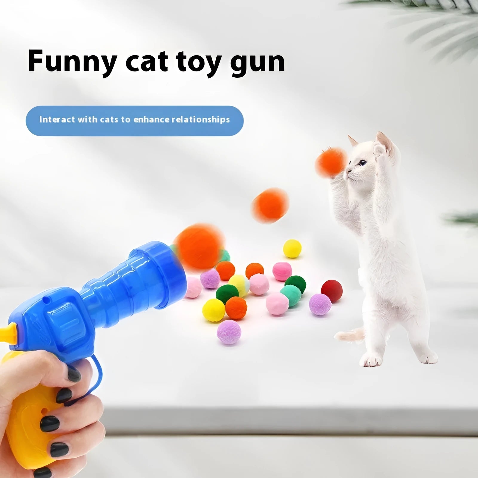 Interactive pet toy gun with multiple plush yarn balls for dogs and cats