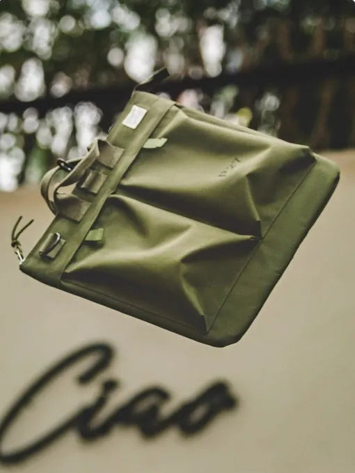 Retro military green canvas messenger bag with crossbody strap and zipper closure