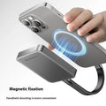 Grey ultra-thin magnetic mobile solid state drive with C to C cable and magnetic suction ring on a table.