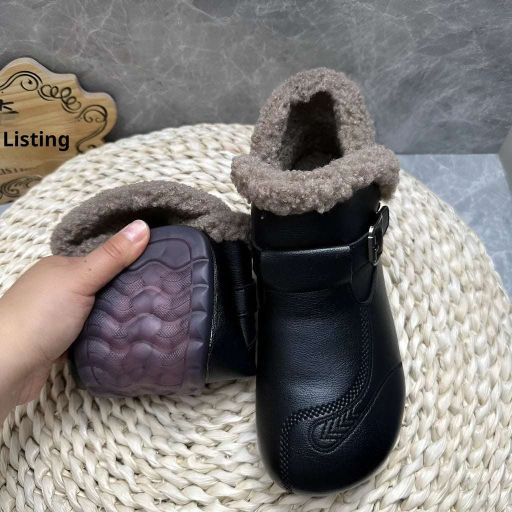 Women's winter slip-on ankle boots with round toe, low platform heel, in black synthetic leather with stitching detail