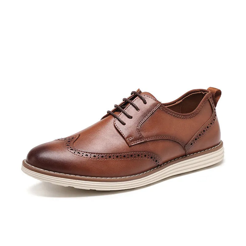 Men's black and brown slip-on casual shoes with round toe and carved detail on the upper.