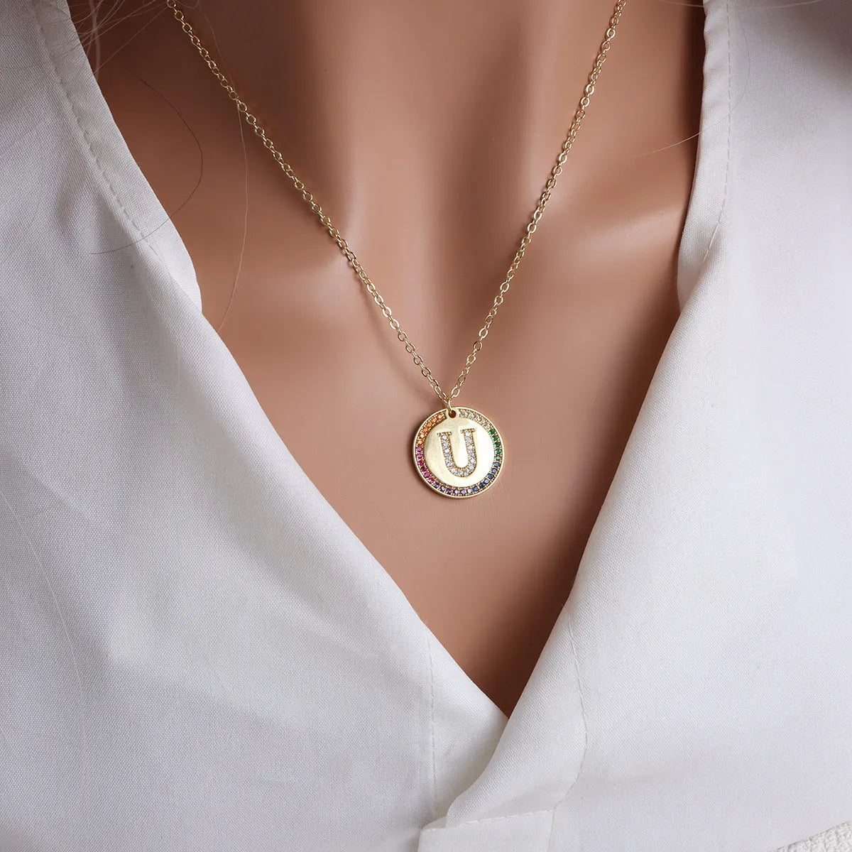 Gold English letter round pendant necklace with colourful crystals on clavicle length chain