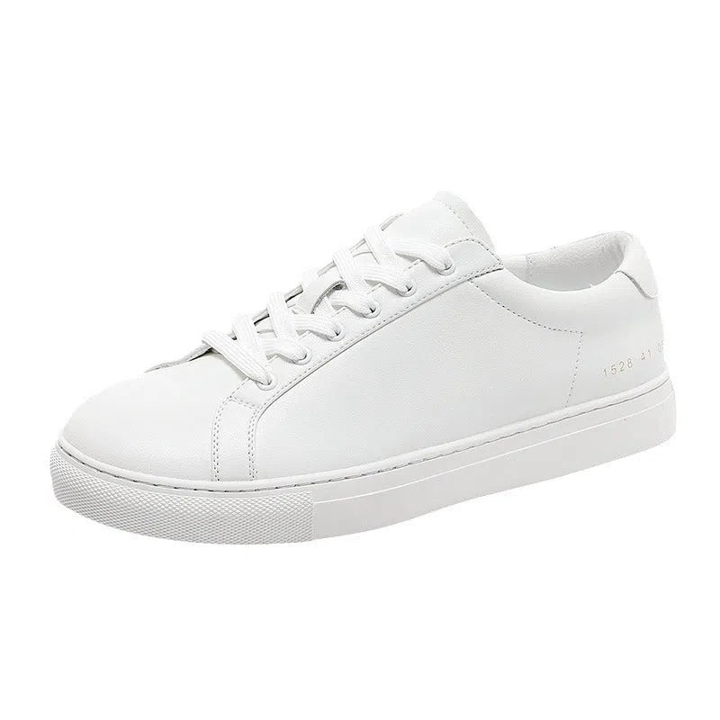 White flat-soled cowhide sneakers with stitching detail and round toe