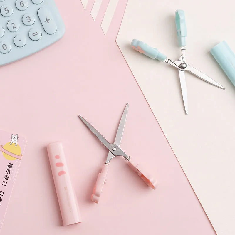 Creative cat claw folding scissors in pen type design, blue colour, on a white background