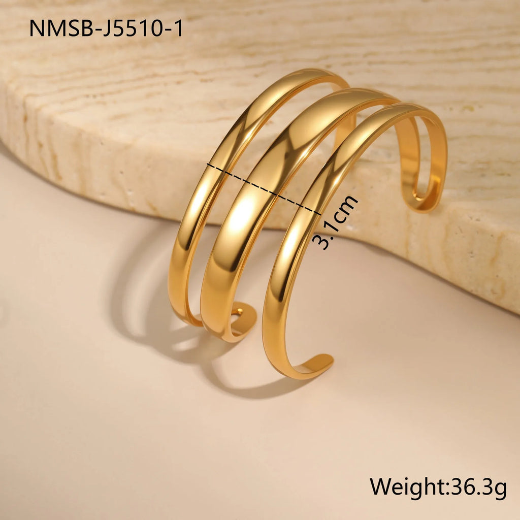 Stainless steel geometric bracelet with simple opening mechanism in gold or steel finish