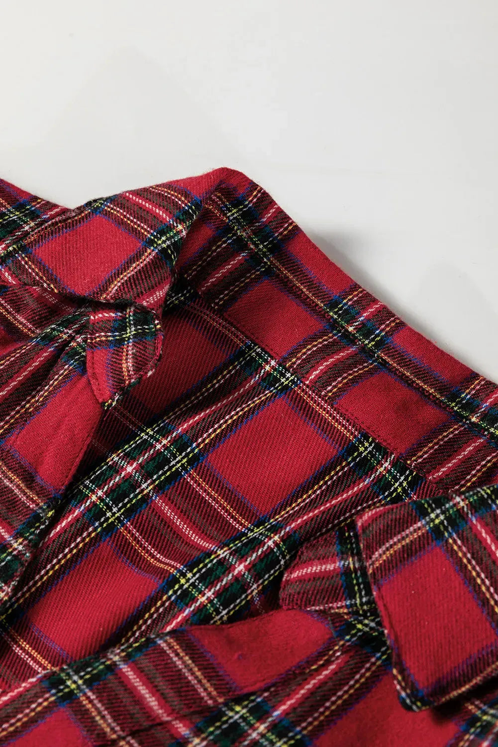 Red plaid mini dress with shirt collar, half button front, long sleeves, and ruffle hem, sizes S to XL