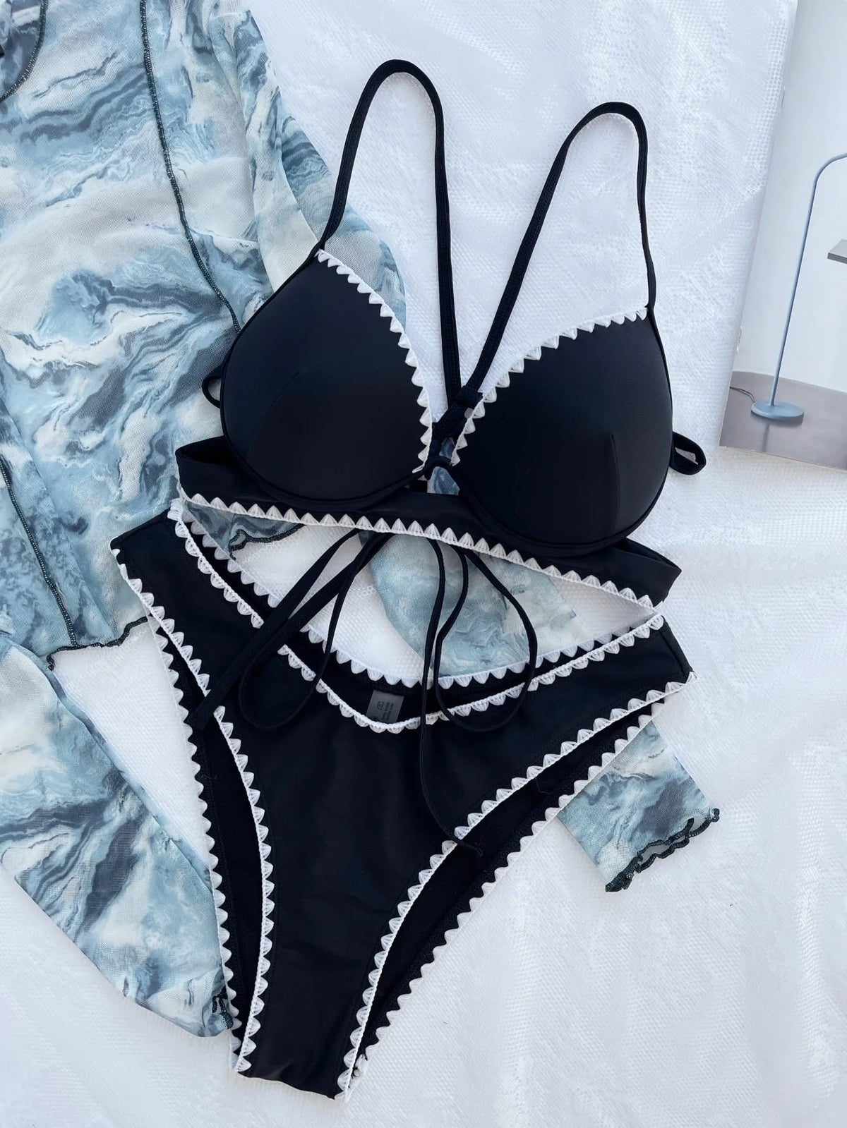 Women's black nylon split bikini swimsuit two-piece set in sizes S, M and L