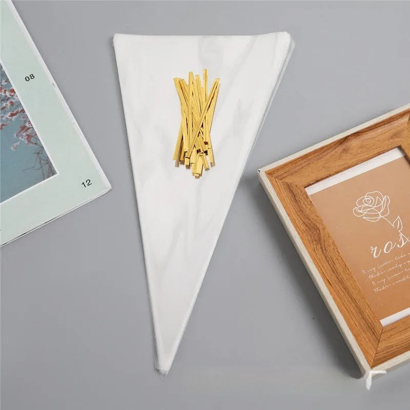 Clear triangular OPP plastic packaging bag with a twisted metal wire tie sealing the top.