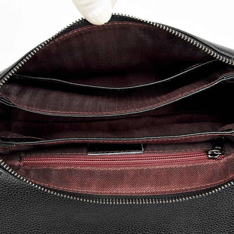 Genuine first-layer cowhide leather shoulder bag in horizontal square shape, 26x16x9cm, black colour, with top zipper and sandwich pocket