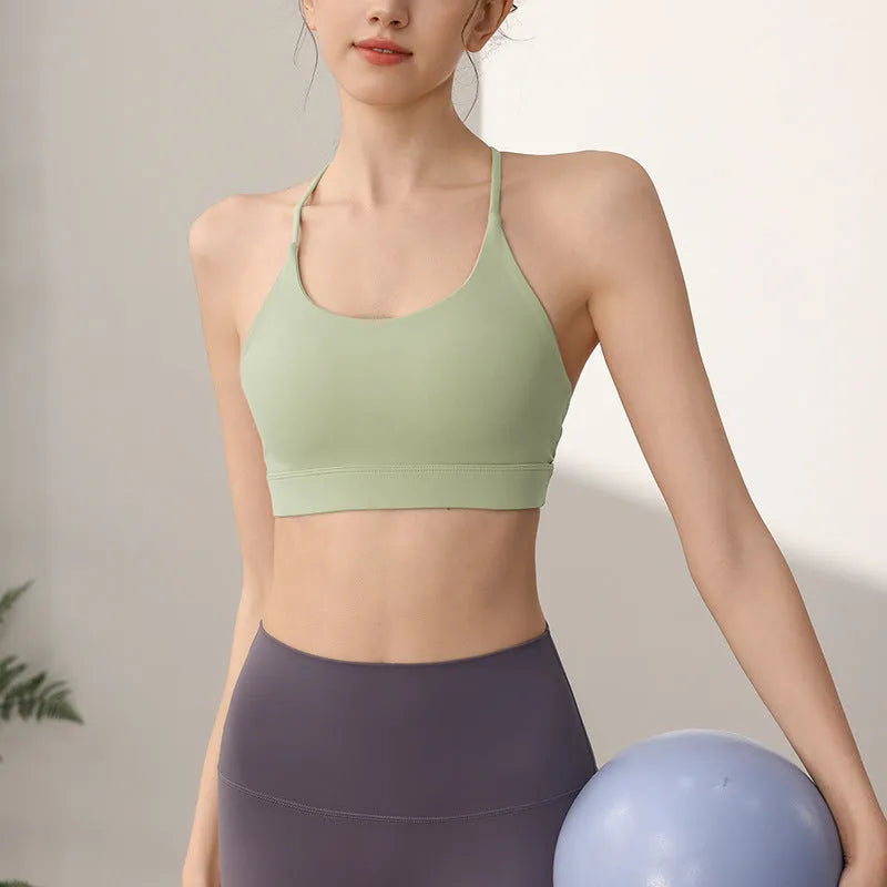 Women's nylon sports vest with fixed double shoulder straps in various colours for running and workout activities