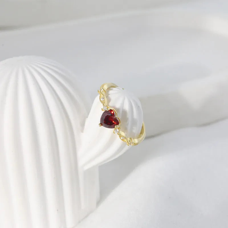 Red zirconium heart-shaped ring in yellow gold electroplated silver with adjustable open band