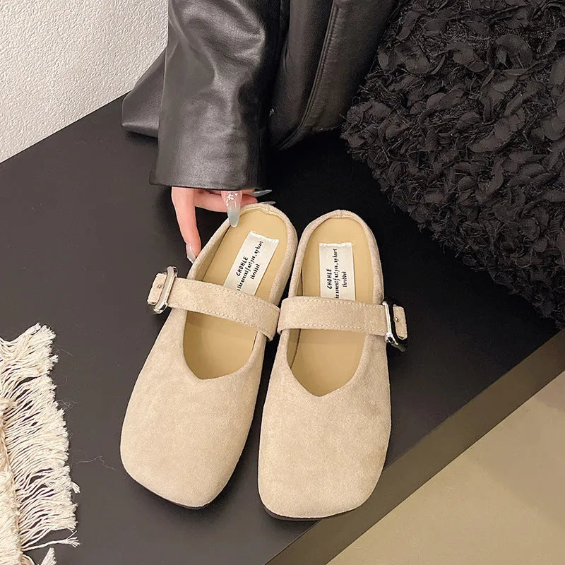 Women's flat apricot coloured slippers with a square toe, PU leather upper, and a dark rubber sole.