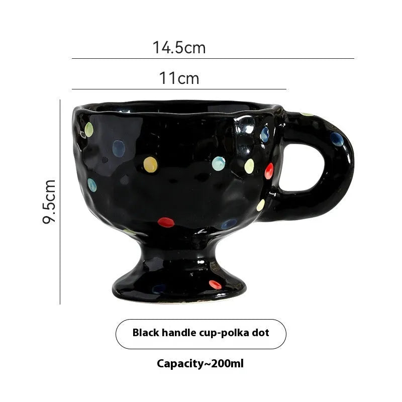 Hand-pinched irregular ceramic mug in a solid colour, showing its unique shape and modern design.