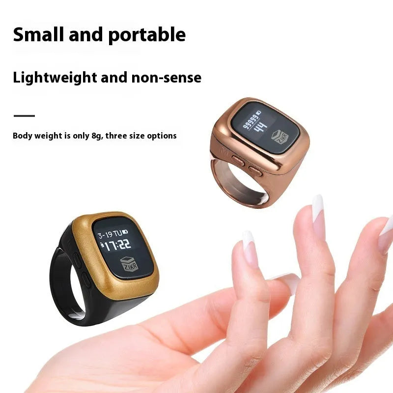 Al-fatiha Zikr electronic counter in black with digital display on a wrist strap.