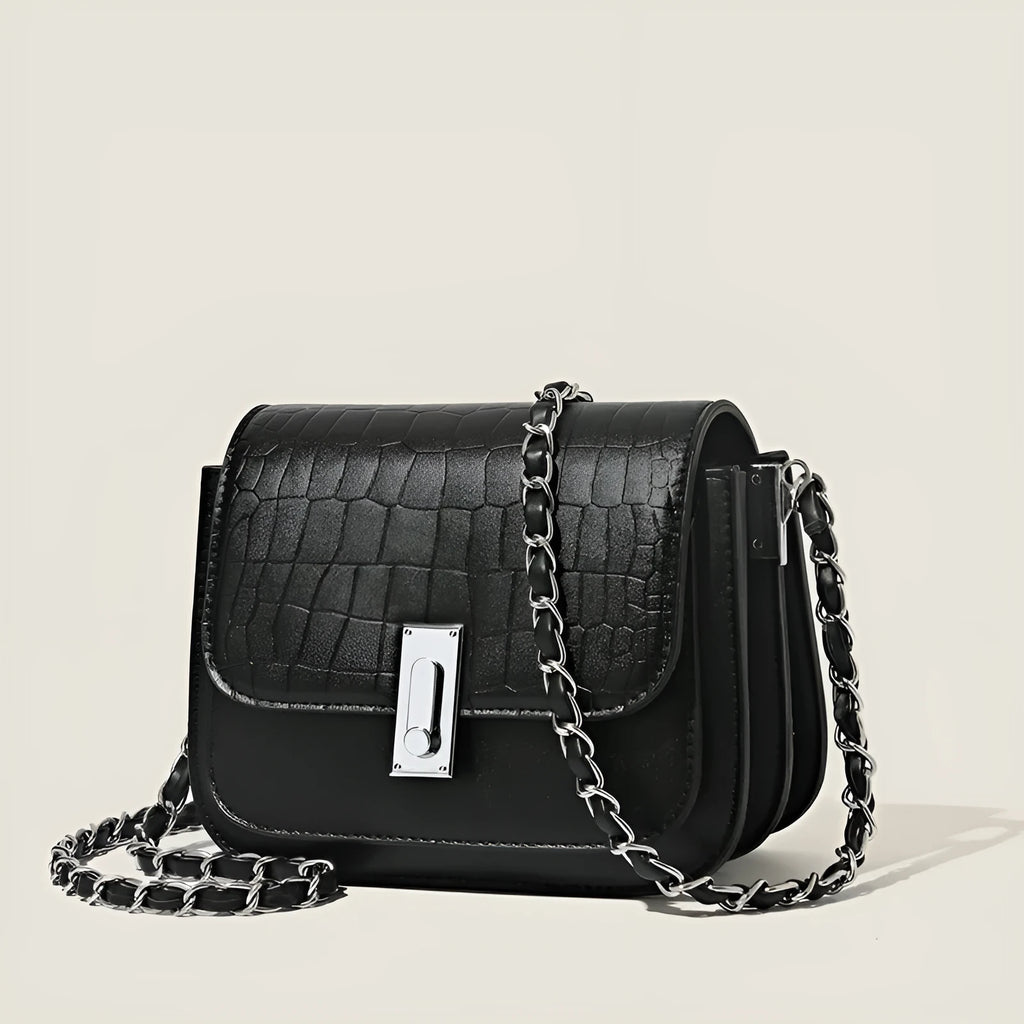 Soft PU leather women's crossbody shoulder bag in black, shown with a phone in the interior pocket.