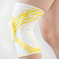 Adult cotton knee pads in blue, grey, and yellow colours, shown for sports like basketball and running.
