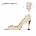 Rhinestone-decorated pointed-toe bridal high heels with a stiletto heel on a white background.