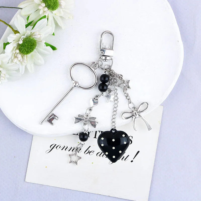 Retro zinc alloy key ring with bow and love heart chain design in multiple colour options