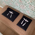 Black and white women's quilted nylon laptop bag with ballet bow in two size options.