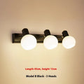 LED wall-mounted washstand mirror front lamp in American simple style, black finish, installed above a bathroom mirror