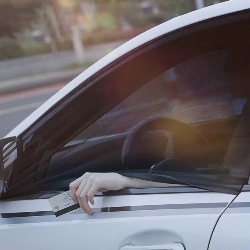 Set of four grey mesh car side window sunshades with elastic edges, shown fitted on a car.