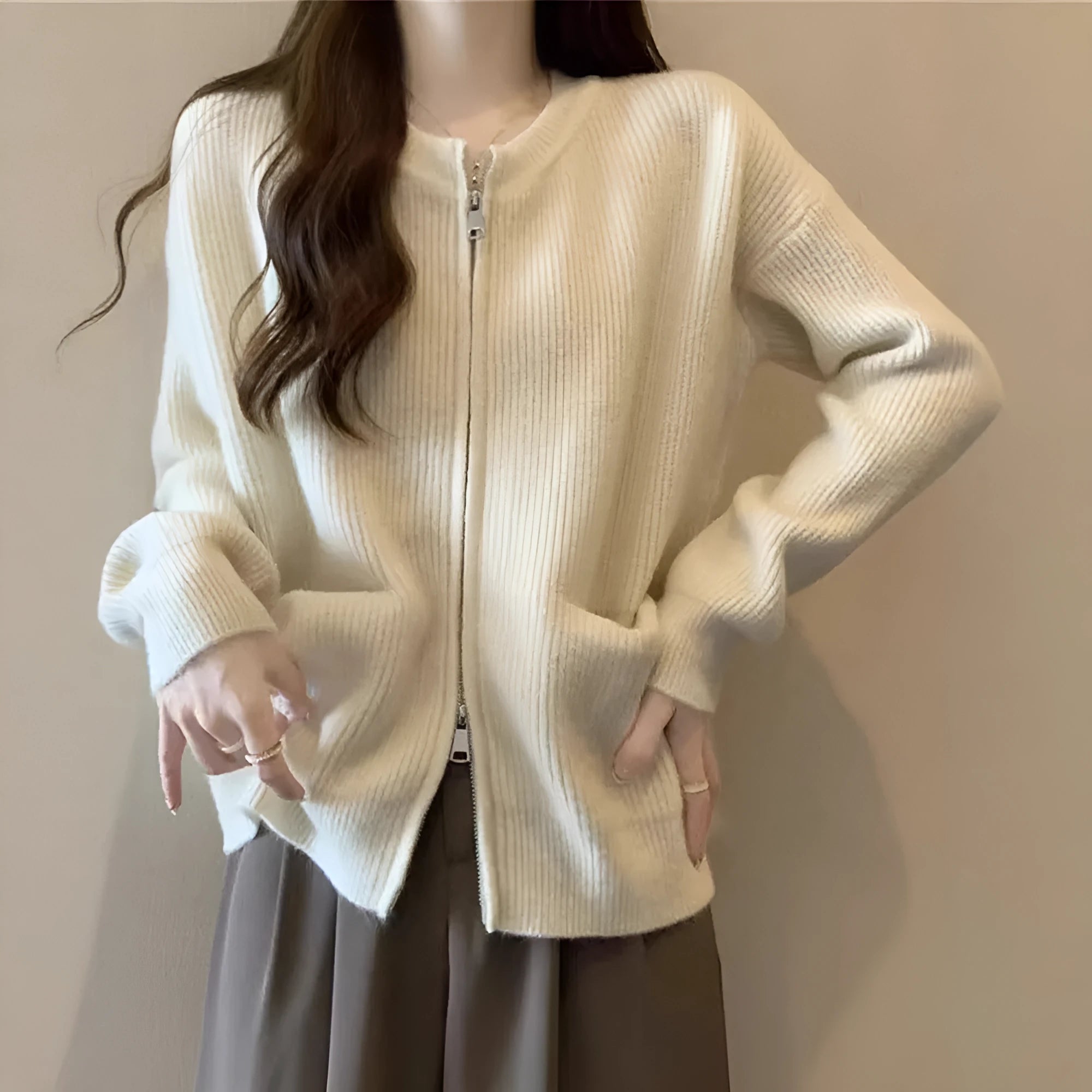 Beige viscose soft sweater coat cardigan with long sleeves on a hanger