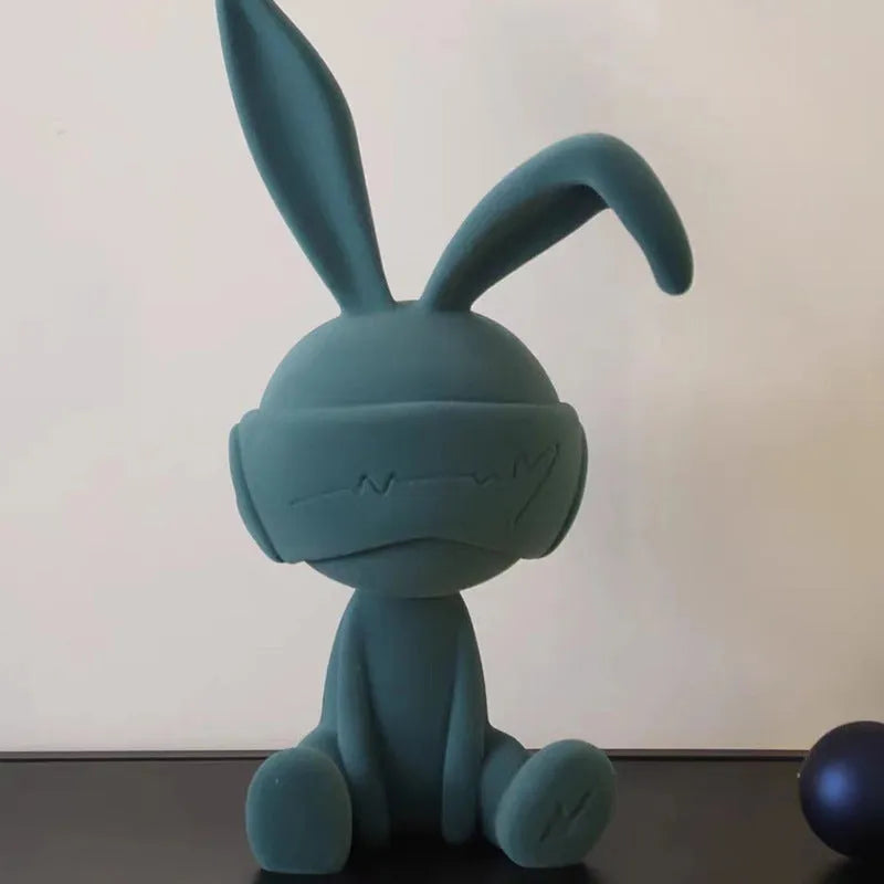 Suede blindfold rabbit resin table ornament in choice of blue, green, or red colours.