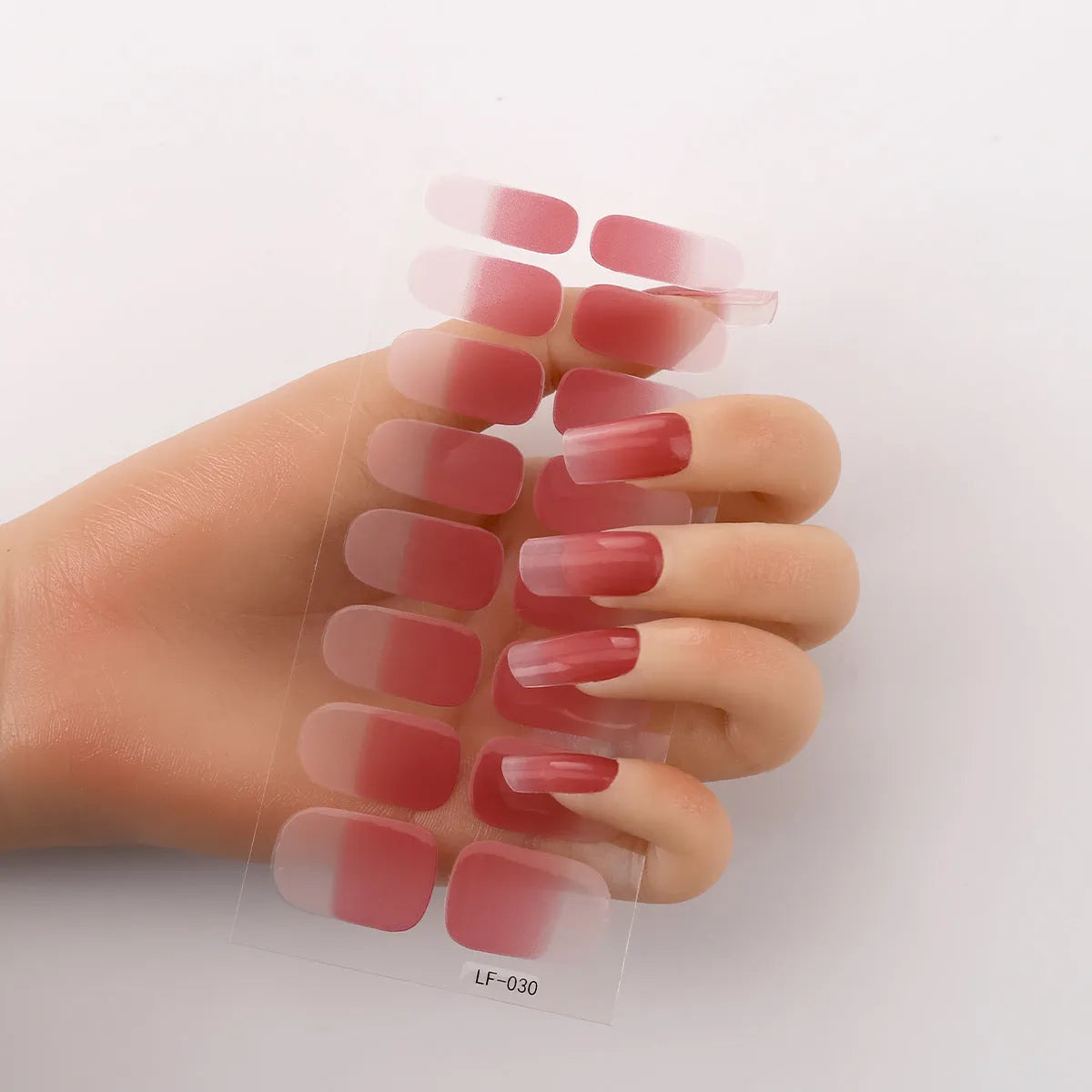 16 solid colour full nail art stickers with 22 patterns including cross, rose, butterfly designs in 12x6mm oval size
