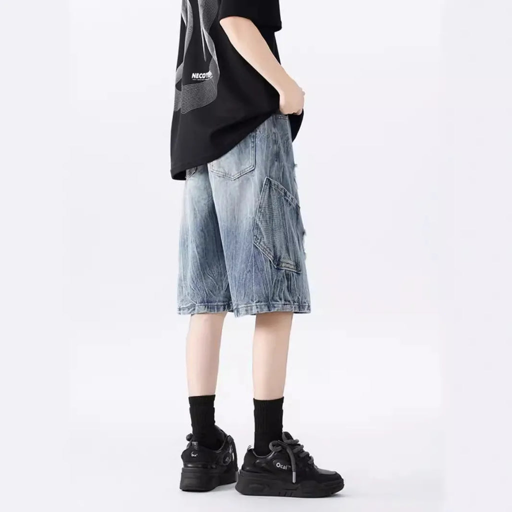 Retro washed denim shorts with loose fit and distressed ripped detailing in black or blue