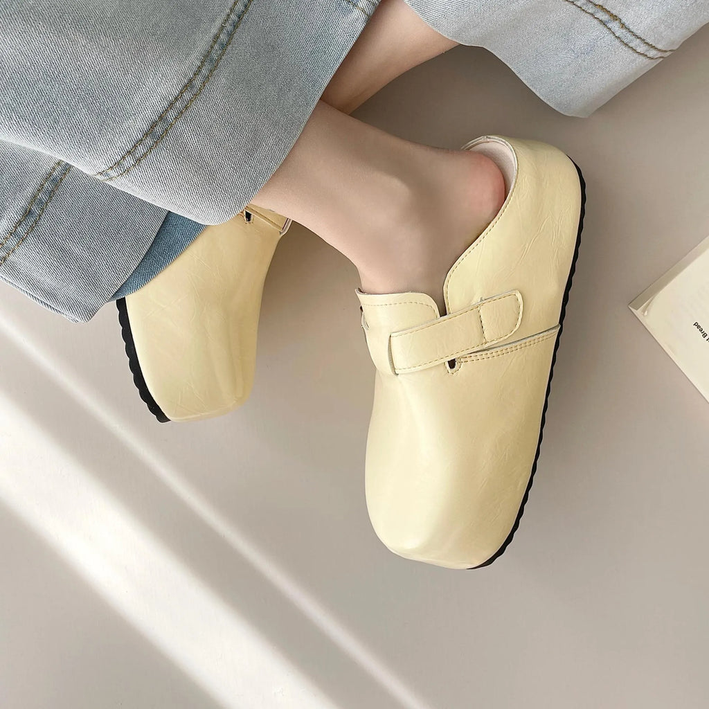 Flat buckle casual sneakers in yellow colour with round toe and PU upper material
