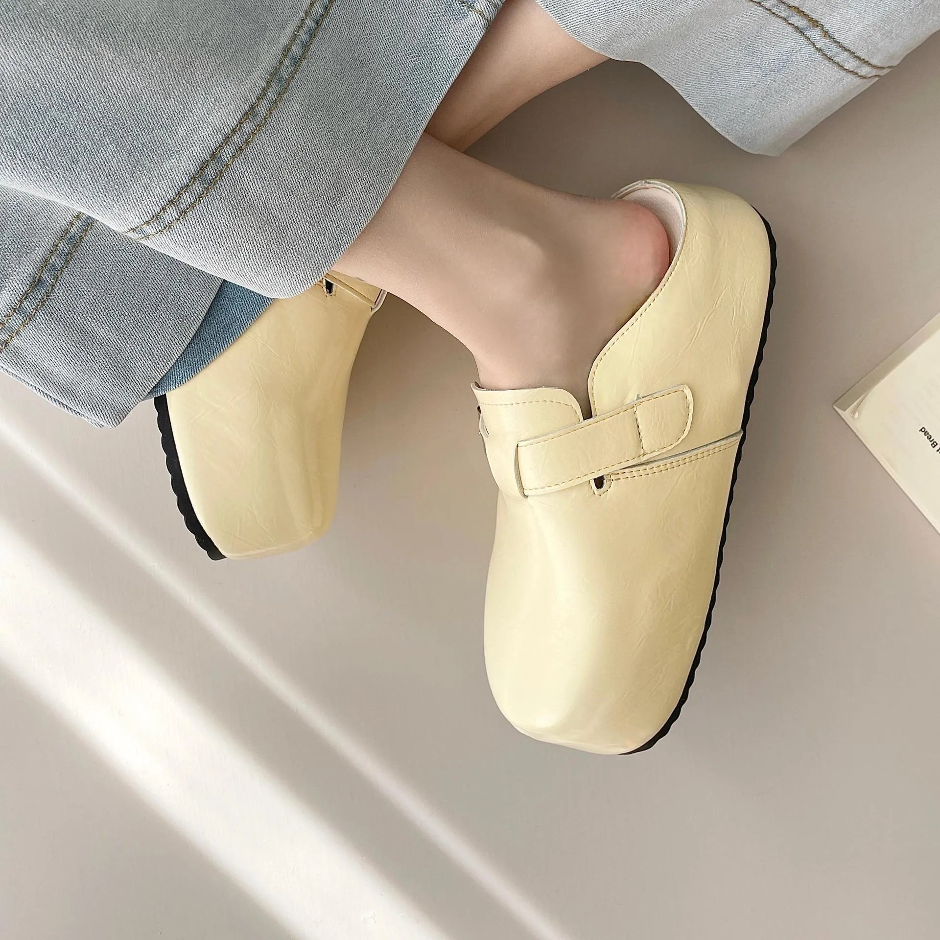 Flat buckle casual sneakers in yellow colour with round toe and PU upper material
