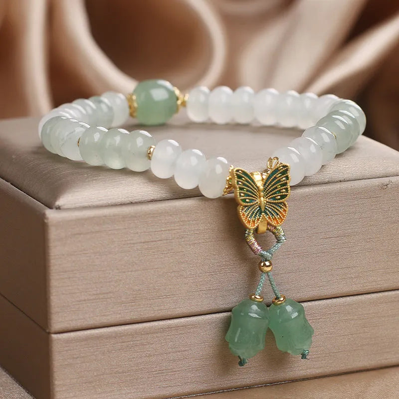 Green jade bracelet with abacus beads and electroplated butterfly tassel decoration