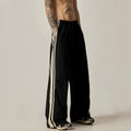 Black high-waist wide-leg climbing trousers for men laid flat, showing straight-leg style.