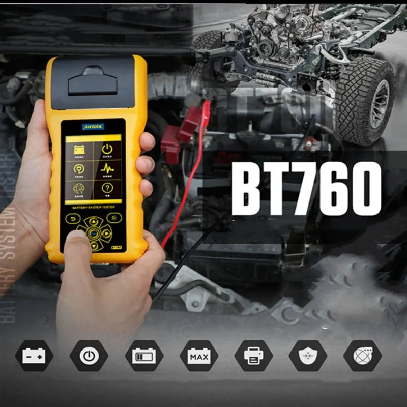 Autool BT760 vehicle battery tester with colour screen and attached test clips on a workbench.