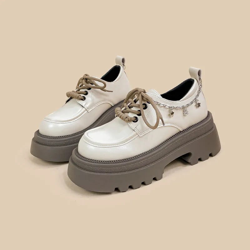 White women's platform Mary Jane shoes with chunky heel and XINGX bear design on round toe