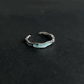 Adjustable navy blue enamel couple ring in copper with geometric texture and split ring design