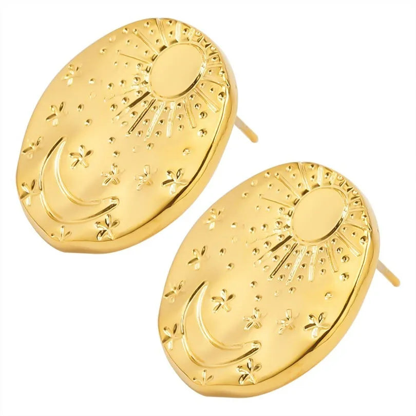 A pair of geometric stainless steel earring studs with a shell detail, shown in gold and silver colours.