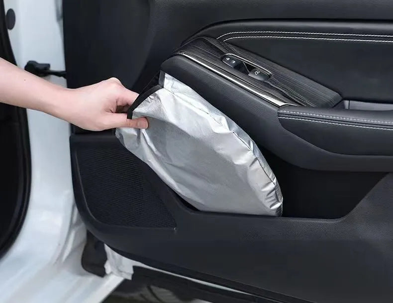 Aluminium foil car windscreen sunshade folded, showing reflective titanium silver surface and size options.