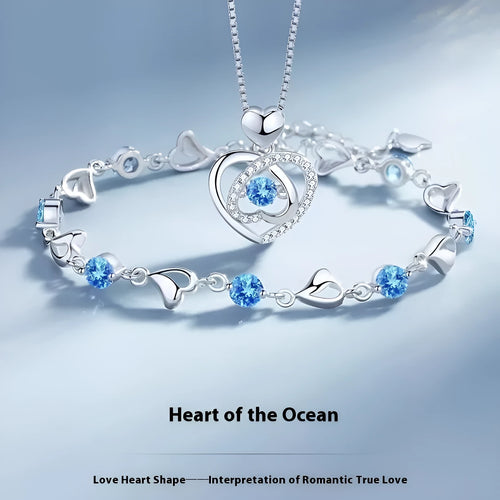 Blue heart-shaped necklace and bracelet set with mixed gem inlay on geometric pendant
