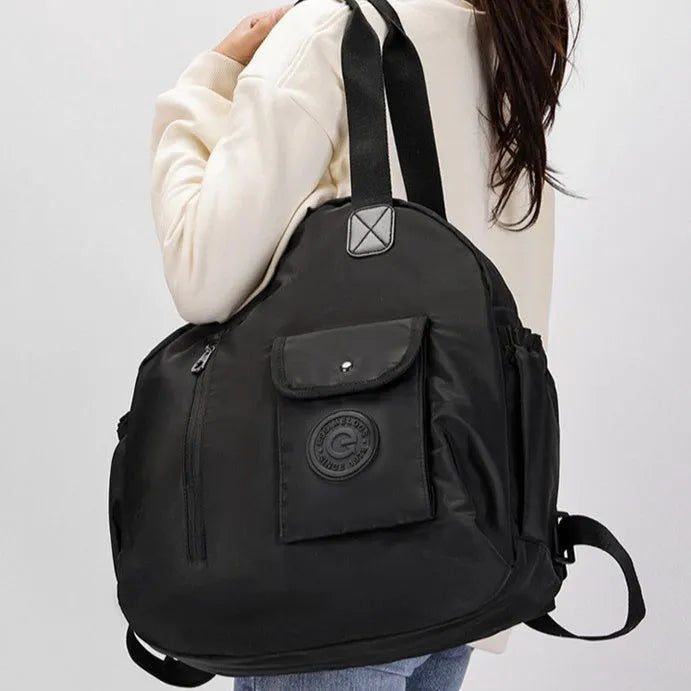 Lightweight large capacity nylon backpack for women in black, khaki, or green letters, showing sandwich pocket.