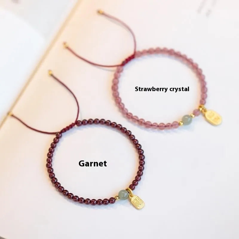 Hand-woven red rope bracelet with strawberry quartz crystals for women