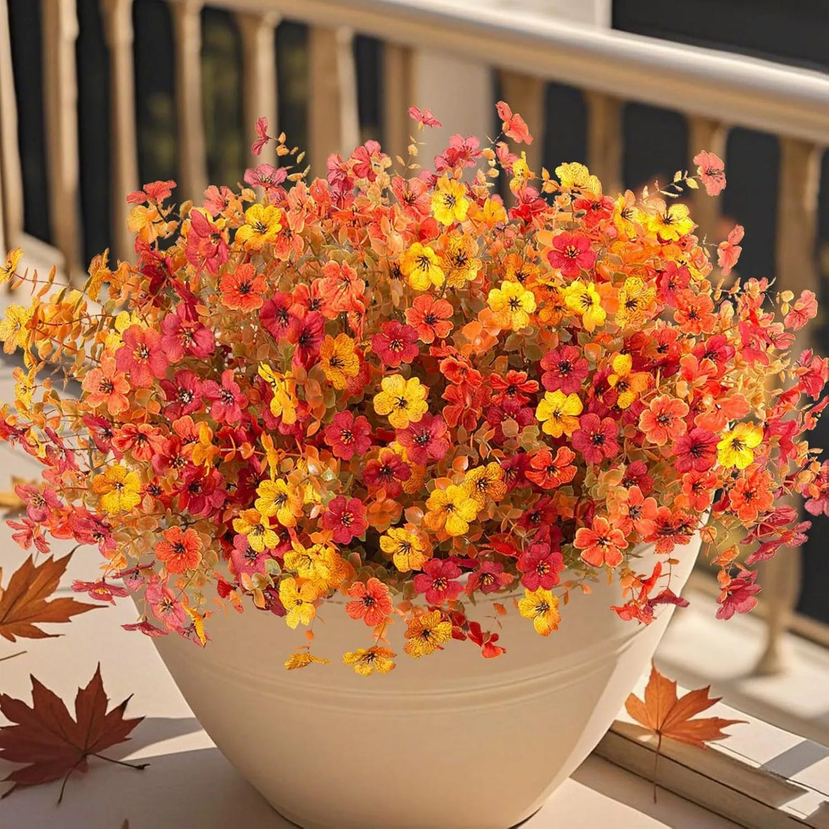 Artificial flower bouquet in autumn colours made from plastic and silk materials.
