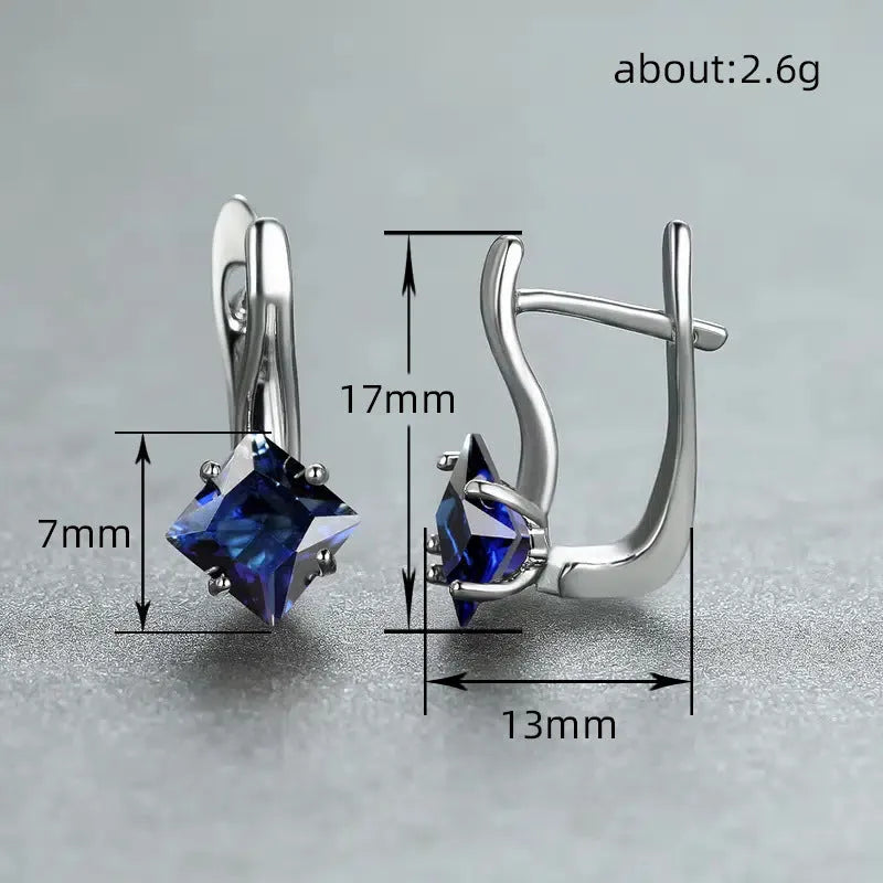 Women's copper earrings with diamond design and inlaid blue zircon stone.
