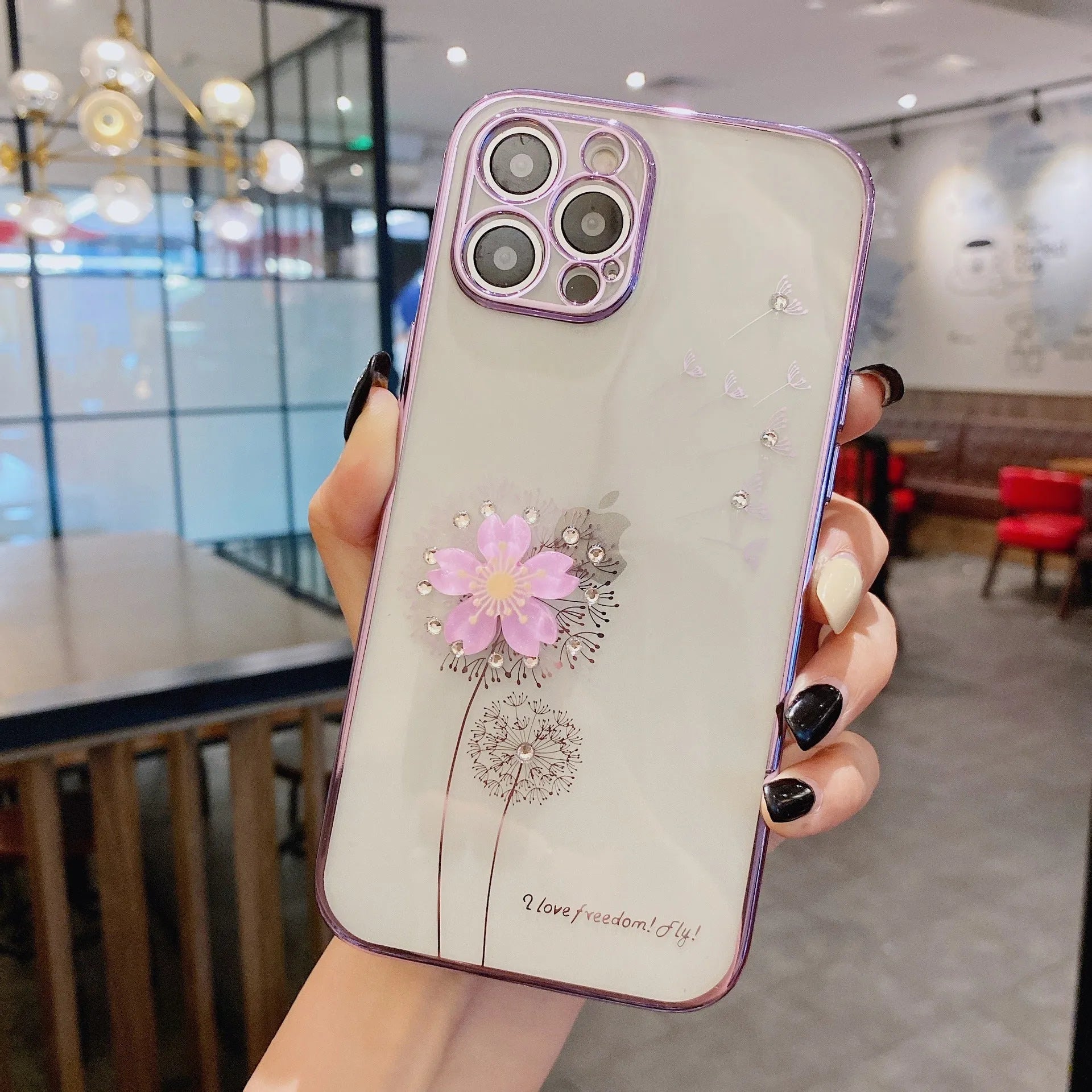 Green TPU iPhone case with a spinning 3D pink flower stand on the back