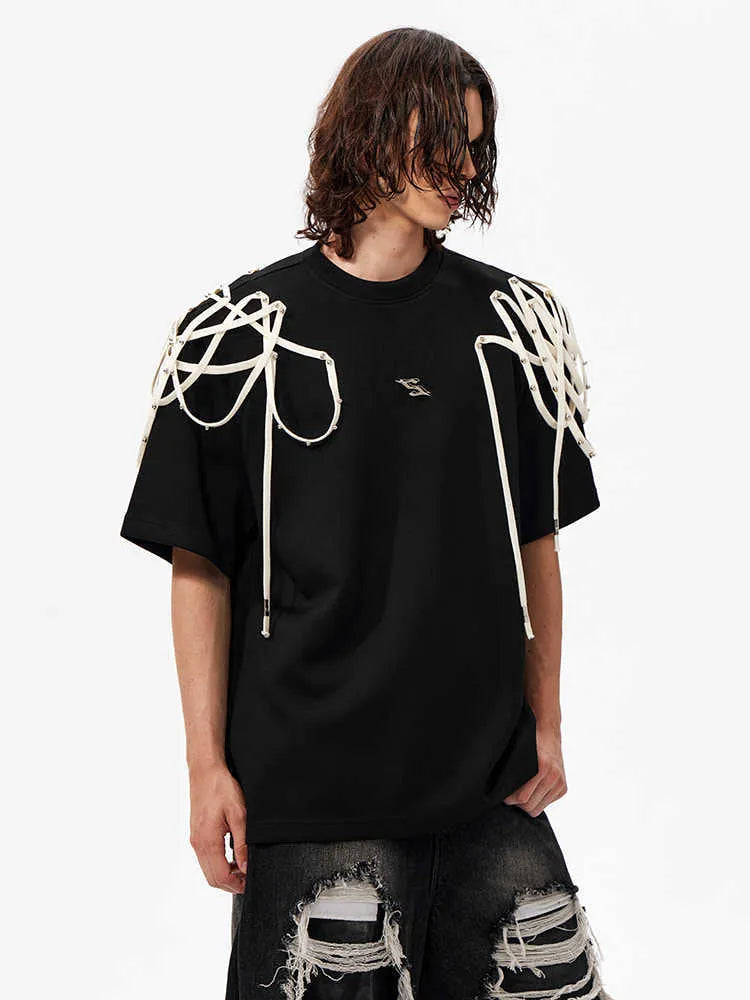 Black loose fit women's T-shirt with padded shoulders featuring rivet ribbon detail