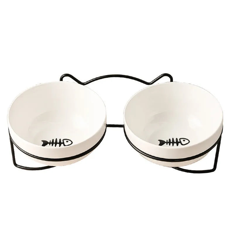 White ceramic pet bowl with cat footprint design and black iron frame