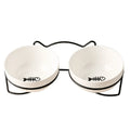 White ceramic pet bowl with cat footprint design and black iron frame