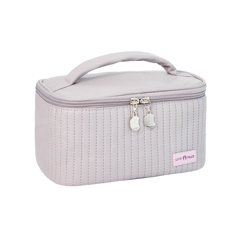 Open-top women's makeup bag in PU leather, shown in a choice of solid colours including pink, beige, and light blue.